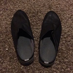 Black leather DKNY slip ons